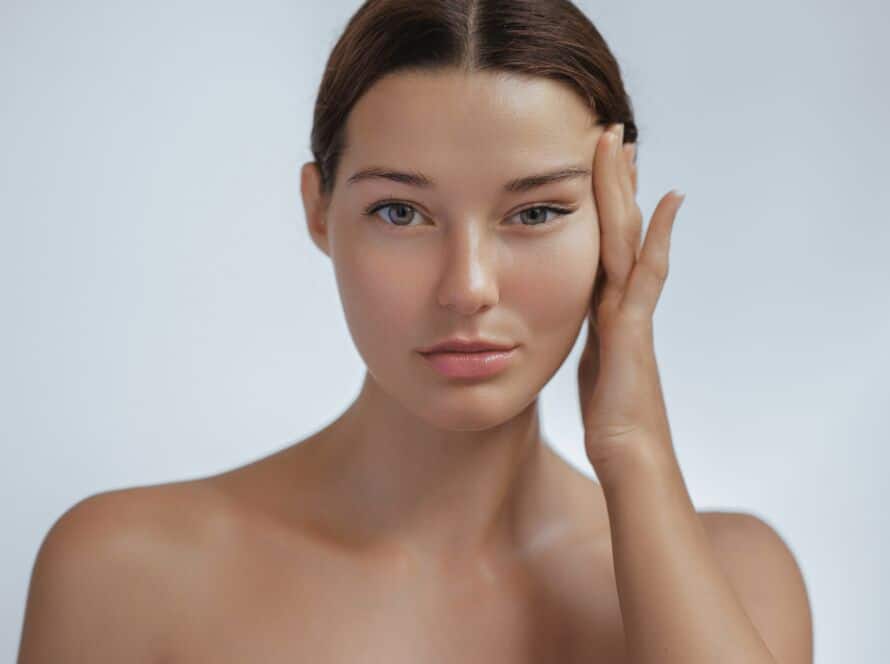 Anti Aging Treatment and Facelift Skin Care Concept. Woman with hand on cheek and eye